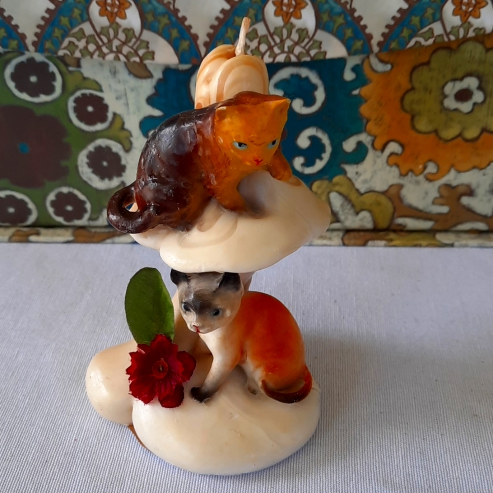 Vintage candle cats on mushroom
